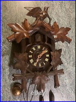 Antique black Forrest cuckoo clock with belle